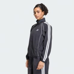 Kultowa bluza dresowa z tkaniny z 3 paskami. Zielone bluzy damskie Adidas, l, bez wzorów, z dresówki, bez kaptura. Za 329.00 zł.