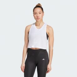 Koszulka Yoga Essentials Cropped. Białe koszulki damskie Adidas, bez wzorów, bez kołnierzyka, bez ramiączek. Za 129.00 zł.