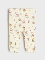 Bawełniane legginsy ze wzorem Winnie the Pooh - beżowy. Brązowe legginsy damskie Sinsay, l, bez wzorów, z bawełny. Za 12.99 zł.