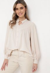 Jasnobeżowa Koszula ze Stójką z Lekko Bufiastymi Rękawami Himastia. Brązowe koszule damskie Born2be, l, bez wzorów, z jeansu, eleganckie, bez kołnierzyka, bez ramiączek. Za 129.99 zł.
