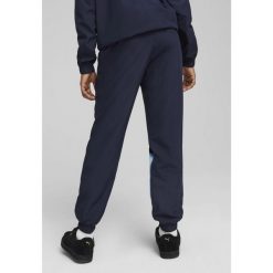 Młodzieżowe spodnie Manchester City ftblARCHIVE PUMA Navy Team Light Blue. Niebieskia spodnie dresowe damskie Puma, m, bez wzorów, z dresówki. W wyprzedaży za 189.00 zł.