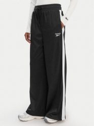 Reebok Spodnie dresowe Dianne RK25512CCW Czarny Relaxed Fit. Czarne spodnie dresowe damskie Reebok, m, bez wzorów, z dresówki. Za 199.99 zł.