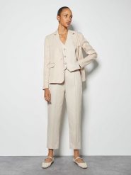 Someday Spodnie w kolorze kremowym rozmiar: 40. Brązowe spodnie materiałowe damskie someday., bez wzorów, z materiału. Za 260.95 zł.