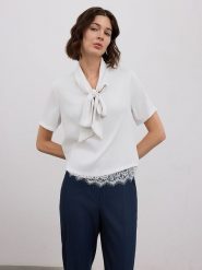 BGN Bluzka w kolorze białym rozmiar: 34. Białe bluzki damskie BGN, bez wzorów, z koronki, bez kołnierzyka, bez ramiączek. Za 65.99 zł.