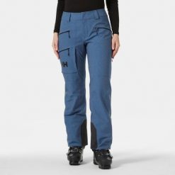 Spodnie narciarskie dla kobiet Helly Hansen Powderqueen. Niebieskie spodnie sportowe damskie Helly Hansen, na zimę, bez wzorów, z puchu, narciarskie. Za 1,190.50 zł.