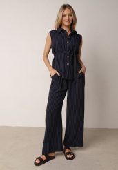 Granatowy Wiskozowy Komplet Szerokie Spodnie i Koszula Bez Rękawów z Wiązaniem Zanran. Niebieskie koszule damskie Born2be, na lato, l, bez wzorów, z tkaniny, eleganckie, bez kołnierzyka, bez ramiączek. Za 139.99 zł.