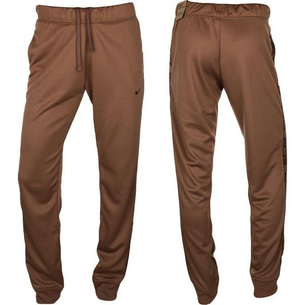 Spodnie Sportowe damskie NSW PK Tape Reg. Brązowe spodnie dresowe damskie Nike, l, bez wzorów. Za 177.00 zł.