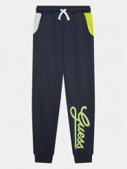 Guess Spodnie dresowe L3YQ34 KA6R3 Granatowy Relaxed Fit. Niebieskie spodnie dresowe chłopięce Guess, z bawełny. Za 369.99 zł.