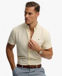 Superdry Koszula Preppy Oxford krótki rękaw Pastel Yellow Chambray. Żółte koszule damskie Superdry, uniwersalny, bez wzorów, z bawełny, klasyczne, bez kołnierzyka, bez ramiączek. Za 314.00 zł.