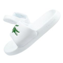 Klapki Lacoste Serve Slide W 02082 białe. Białe klapki damskie bez wzorów, z syntetyku, bez obcasa, bez zapięcia. W wyprzedaży za 312.50 zł.