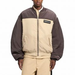 Kurtka REEBOK BOMBER JACKET Brązowy. Brązowe kurtki damskie Reebok, bez wzorów, z tkaniny, bez kaptura. Za 559.99 zł.