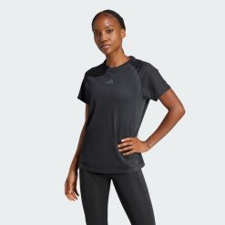 Bezszwowa koszulka z dzianiny. Czarne koszulki damskie Adidas, bez wzorów, z dzianiny, bez kołnierzyka, bez ramiączek. Za 199.00 zł.