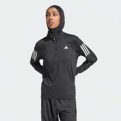 Kurtka Own the Run Half-Zip. Czarne kurtki damskie Adidas, s, bez wzorów, z materiału, bez kaptura. Za 204.55 zł.