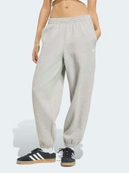 Adidas Spodnie dresowe w kolorze szarym rozmiar: L. Szare spodnie dresowe damskie Adidas, l, bez wzorów, z dresówki. Za 164.95 zł.