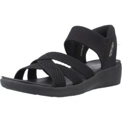 Sandały SKECHERS SLIP-INS ARYA Czarny. Czarne sandały damskie Skechers, bez wzorów, z materiału, bez obcasa, bez zapięcia. Za 279.99 zł.