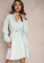 Jasnoniebieska Rozkloszowana Sukienka z Koronkowymi Wstawkami i Wiązaniem w Talii Padria. Niebieskie sukienki damskie Renee, bez wzorów, z koronki, eleganckie, bez ramiączek. W wyprzedaży za 101.99 zł.