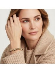 Otazu Pozłacana bransoletka z kryształami Swarovski rozmiar: onesize. Czarne bransoletki damskie Otazu, pozłacane. Za 104.99 zł.