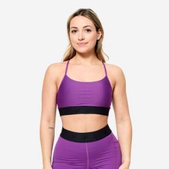 Stanik sportowy Decathlon. Fioletowe biustonosze sportowe damskie DOMYOS, bez wzorów, z elastanu. W wyprzedaży za 39.99 zł.