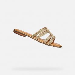 Sandały GEOX D SOZY PLUS Złoty. Żółte sandały damskie Geox, bez wzorów, ze skóry, bez obcasa, bez zapięcia. Za 349.99 zł.
