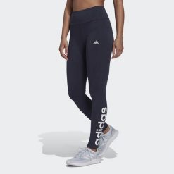 Leginnsy Essentials High-Waisted Logo. Białe obuwie sportowe treningowe Adidas, na fitness i siłownię. Za 81.00 zł.