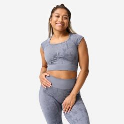 Koszulka fitness damska Domyos crop top seamless. Szare bluzki damskie DOMYOS, xl, bez wzorów, z materiału, sportowe, bez kołnierzyka, bez ramiączek. Za 89.99 zł.