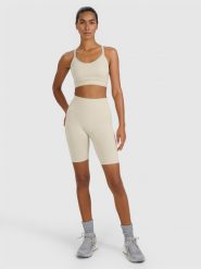 4F Legginsy kolarki treningowe bezszwowe damskie - beżowe M/L. Brązowe legginsy damskie 4F, l, bez wzorów, z dzianiny. Za 119.99 zł.