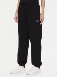 Calvin Klein Jeans Spodnie dresowe Monologo LV047B235G Czarny Regular Fit. Czarne spodnie dresowe damskie Calvin Klein Jeans, xs, bez wzorów, z bawełny. Za 269.99 zł.