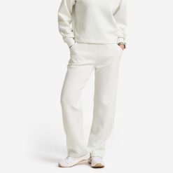 Spodnie dresowe damskie Gym & Pilates. Białe spodnie dresowe damskie Decathlon, l, bez wzorów, z dresówki. Za 129.99 zł.