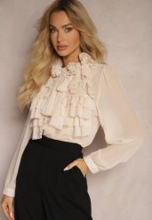 Beżowa Prześwitująca Koszula z Falbankami i Kwiatowym Zdobieniem przy Dekolcie Raivona. Brązowe koszule damskie Renee, m, z aplikacjami, z jeansu, eleganckie, bez kołnierzyka, bez ramiączek. Za 139.99 zł.