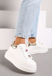 Biało-Złote Sneakersy na Grubej Podeszwie Ozdobione Metalicznymi Aplikacjami Nevelina. Białe obuwie sportowe damskie Born2be, z materiału, bez zapięcia. Za 99.99 zł.