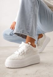 Białe Koronkowe Sneakersy na Platformie z Tłoczeniem i Brokatem Phisnell. Białe obuwie sportowe damskie Renee, z koronki, bez zapięcia. Za 119.99 zł.