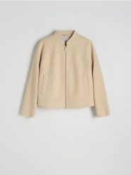 Krótka flauszowa kurtka oversize - kremowy. Białe kurtki damskie Reserved, l, bez wzorów, z tkaniny, bez kaptura. W wyprzedaży za 89.99 zł.