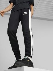 Puma Spodnie dresowe "Iconic T7" w kolorze czarnym rozmiar: S. Czarne spodnie dresowe damskie Puma, s, bez wzorów, z dresówki. Za 122.96 zł.
