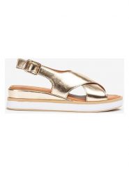 Unisa Skórzane sandały w kolorze złotym na koturnie rozmiar: 37. Żółte sandały damskie Unisa, bez wzorów, z otwartym noskiem, bez obcasa, na koturnie, bez zapięcia. Za 173.99 zł.