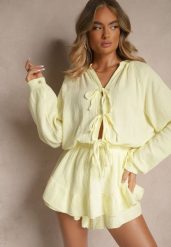 Żółty Kombinezon z Bawełny Ozdobiony Wiązaniem i Falbankami Nalelia. Żółte sukienki damskie Renee, bez wzorów, z bawełny, eleganckie, bez ramiączek. W wyprzedaży za 151.99 zł.