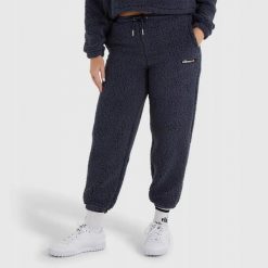 SPODNIE DAMSKIE DRESOWE SHARP ELLESSE SPORTOWE NIEBIESKIE. Niebieskie spodnie sportowe damskie Ellesse, m, bez wzorów, z bawełny, na fitness i siłownię. Za 179.83 zł.