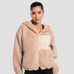 Kurtka damska fitness z kapturem oversize Sherpa Canyon. Brązowe kurtki damskie GYMBEAM, m, bez wzorów, z materiału, z kapturem. Za 188.90 zł.