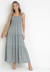 Jasnoniebieska Sukienka Rozkloszowana na Ramiączkach w Kwiaty Hasana. Niebieskie sukienki damskie Born2be, bez wzorów, eleganckie, bez ramiączek. Za 149.99 zł.