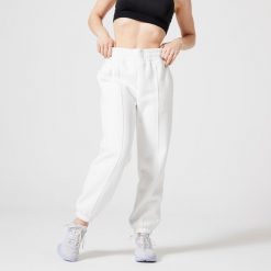 Spodnie dresowe damskie Domyos Gym & Pilates 500. Białe spodnie dresowe damskie DOMYOS, bez wzorów, z bawełny. W wyprzedaży za 79.99 zł.