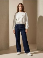 Bawełniane jeansy wide straight leg - niebieski. Niebieskie jeansy damskie Sinsay. Za 49.99 zł.