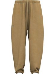 Under Armour Spodnie dresowe "Icon" w kolorze jasnobrązowym rozmiar: S. Brązowe spodnie dresowe damskie Under Armour, s, bez wzorów, z bawełny. Za 188.40 zł.