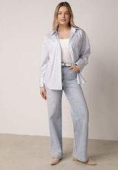 Niebieskie Bawełniane Jeansy o Szerokim Kroju z Wysokim Stanem Jendrea. Niebieskie jeansy damskie Born2be, bez wzorów, z bawełny. Za 129.99 zł.