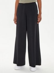 Guess Spodnie dresowe V4YB07 KCAY2 Czarny Relaxed Fit. Czarne spodnie dresowe damskie Guess, xl, z aplikacjami, z dresówki. Za 259.99 zł.
