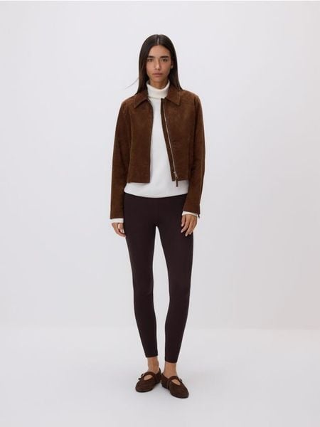 Bawełniane legginsy - ciemnobrązowy. Brązowe legginsy damskie Reserved, l, bez wzorów, z bawełny. Za 49.99 zł.