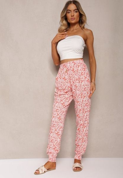 Pomarańczowe Wiskozowe Spodnie w Kwiaty z Gumką w Pasie Rivabele. Brązowe spodnie materiałowe damskie Renee, bez wzorów, z jeansu. Za 34.99 zł.