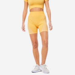 Spodenki fitness damskie Domyos krótkie. Żółte spodenki sportowe damskie DOMYOS, l, bez wzorów, z materiału, z podwyższonym stanem, na fitness i siłownię. Za 59.99 zł.
