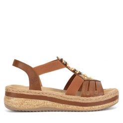 Sandały Rieker. Brązowe sandały damskie Rieker, bez wzorów, bez obcasa, na koturnie, bez zapięcia. Za 329.99 zł.
