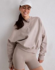 Damska bluza biegowa oddychająca, odprowadzająca wilgoć Le Run ciemna glina. Brązowe bluzy damskie Aim'n, l, bez wzorów, z bawełny, bez kaptura. Za 387.00 zł.