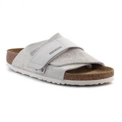 Klapki damskie Birkenstock Kyoto. Szare klapki damskie Birkenstock, bez wzorów, z materiału, bez obcasa, bez zapięcia. Za 761.85 zł.