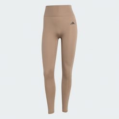Legginsy Optimé Essentials No Front Rise Seam 7/8. Brązowe legginsy damskie Adidas, l, bez wzorów. W wyprzedaży za 175.20 zł.